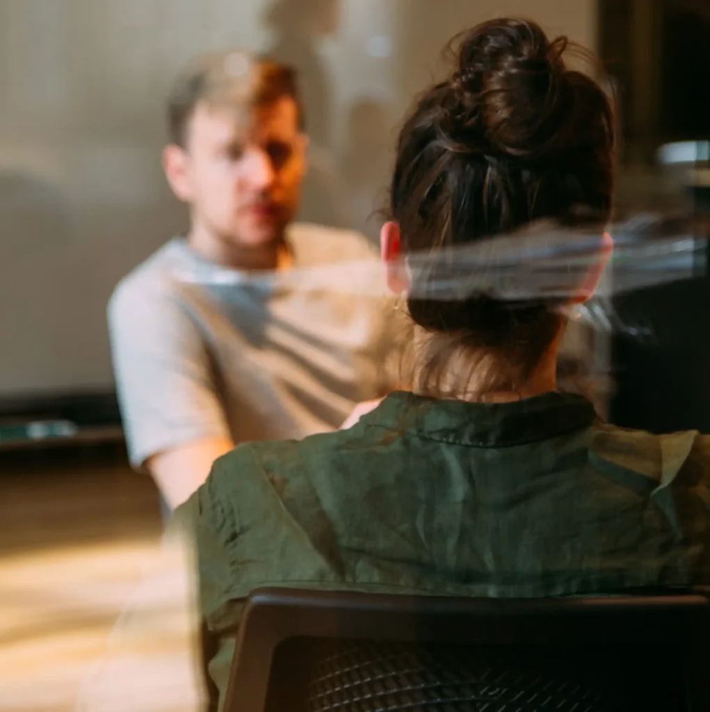 Client speaking with a therapist during a private one-to-one therapy session