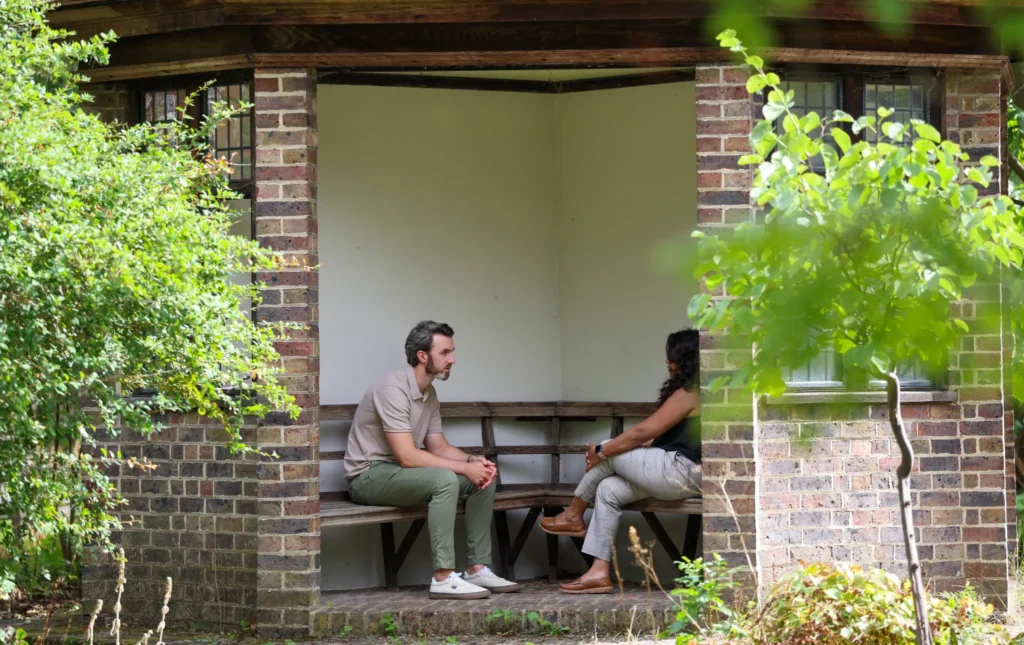 Ryan Hegarty speaking with a client during an outdoor therapy session for professionals in Essex